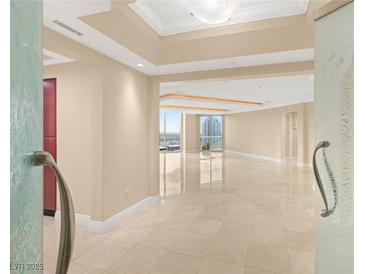 Bright, open living room with marble floors and city views at 2747 Paradise Rd # 2704, Las Vegas, NV 89109