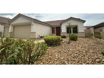 Charming single-story home featuring a xeriscaped front yard and a two-car garage at 33 Hatten Bay St, Henderson, NV 89012