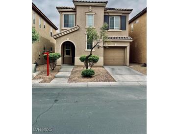 Charming two-story home with desert landscaping and a two-car garage at 7513 Brisa Del Mar Ave, Las Vegas, NV 89179