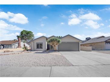 Charming single-story home with desert landscaping and a two-car garage at 3115 Floral Vista Ave, Henderson, NV 89014
