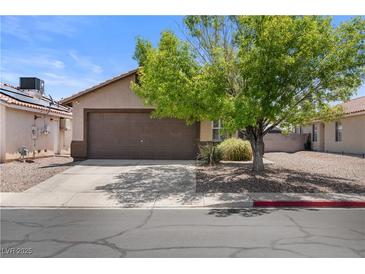Charming single-story home features a two-car garage and well-maintained landscaping at 5550 Ramirez St, North Las Vegas, NV 89031