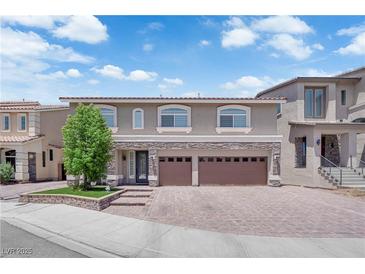 Beautiful two-story home featuring a three-car garage and well-maintained front yard at 5788 Robin Ridge Ave, Las Vegas, NV 89141