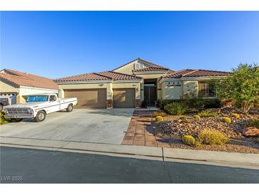 Charming single-story home with a three-car garage and well-maintained desert landscaping at 6413 White Tiger Ct, Las Vegas, NV 89130