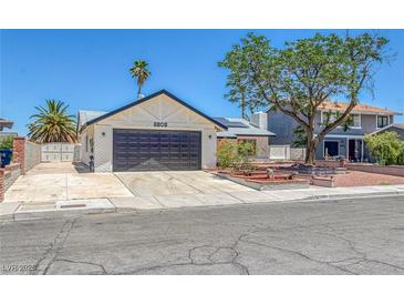 Charming single-story home showcasing a well-manicured front yard, a two-car garage, and desert landscaping at 6808 Waterhen Cir, Las Vegas, NV 89108