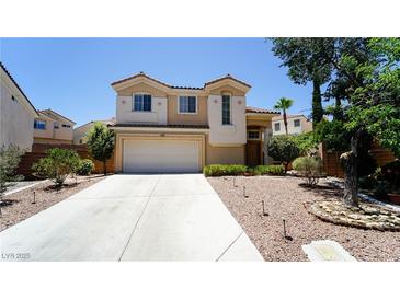 Charming two-story home featuring a spacious driveway and a well-manicured yard in a desirable neighborhood at 2017 Shining Feather Ln, Las Vegas, NV 89134