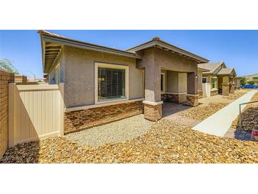 Charming single-story home featuring tasteful brick accents and inviting front entryway at 209 Bennett Pointe Ave, Henderson, NV 89011