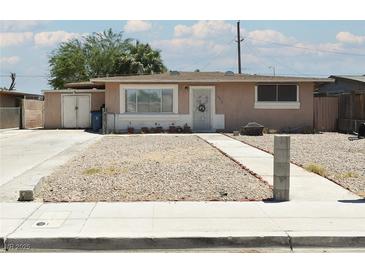 Charming single-story home with gravel front yard and sidewalk leading to the entrance at 2616 Spear St, North Las Vegas, NV 89030