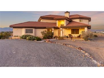 Stunning single-story home with desert landscaping and red tile roof at 3821 Tumbleweed Ave, Pahrump, NV 89048
