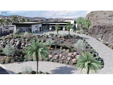 Modern home with desert landscaping, circular driveway and palms at 645 Dragon Peak Dr, Henderson, NV 89012