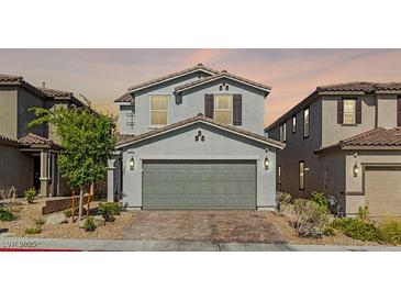 Charming two-story home featuring a well-maintained front yard and a two-car garage at 6964 Caldera St, Las Vegas, NV 89149