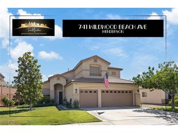 Charming two-story home featuring a three-car garage and well-maintained landscaping at 741 Wildwood Beach Ave, Henderson, NV 89052