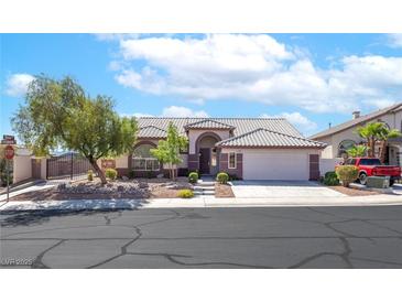 Charming single-story home with a well-maintained front yard and a two-car garage at 786 Craigmark Ct, Henderson, NV 89002