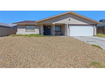 Charming single-story home with a two-car garage and low-maintenance rock landscaping at 824 Antigua St, Las Vegas, NV 89145