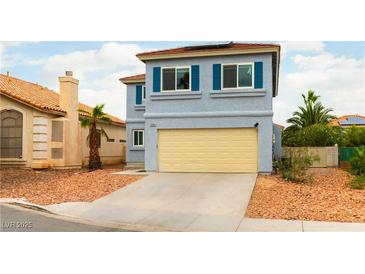 Two-story home with a blue exterior, red roof, tan garage door, and a desert-landscaped front yard at 8484 Montana Stream Ave, Las Vegas, NV 89113