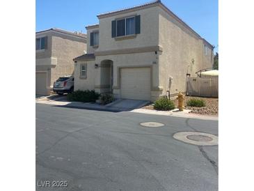 Charming two-story home featuring a one-car garage and low-maintenance landscaping in a desirable neighborhood at 9980 Keephills St, Las Vegas, NV 89183
