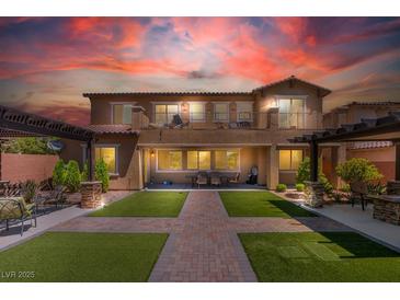 Stunning backyard with manicured lawn, patio, pergola, and balcony, perfect for outdoor living at , Las Vegas, NV 89149