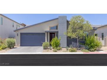 Modern single-story home with desert landscaping and a gray accent chimney at 9785 Granite Mesa St, Las Vegas, NV 89141