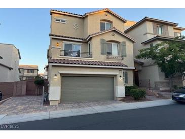 Inviting two-story home with a two-car garage and charming architectural details at 10725 Wrigley Field Ave, Las Vegas, NV 89166