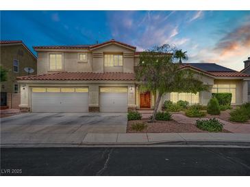 Stunning two-story home featuring a three-car garage and a meticulously landscaped front yard at 2010 Catalina Marie Ave, Henderson, NV 89074