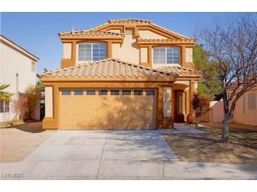 Charming tan two-story home featuring a two-car garage and well-maintained landscaping at 3412 Adventure Ct, Las Vegas, NV 89129