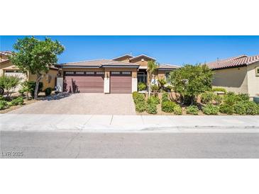 Charming single-story home featuring a well-manicured yard and a spacious three-car garage at 357 S Milan St, Henderson, NV 89015