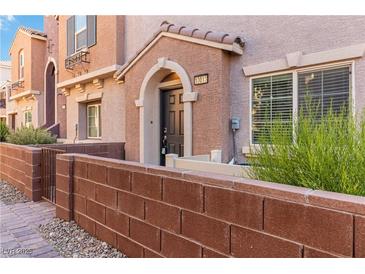 Charming townhome featuring a private entrance and well-maintained landscaping at 10013 Sable Point St, Las Vegas, NV 89178