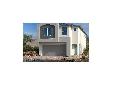 Two-story home with gray garage door, tan concrete, and front shrubs at 10275 Water Knot Ave, Las Vegas, NV 89166