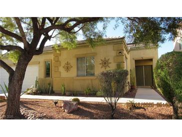 Charming single story home featuring xeriscaping, desert landscaping, and a two-car garage at 1504 Andrew David Ave, North Las Vegas, NV 89086