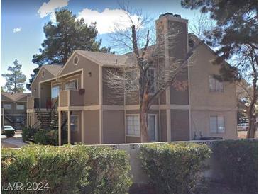 A charming apartment complex with a well-maintained exterior and mature landscaping at 2705 Jennydiane Dr, Las Vegas, NV 89121