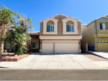 Charming two-story home with a spacious two-car garage and well-maintained front yard at 8125 Rio De Janeiro Dr, Las Vegas, NV 89128