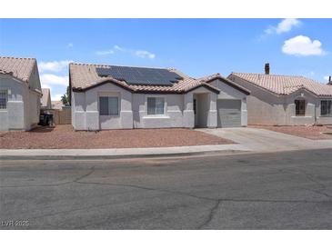 Charming single-story home featuring desert landscaping and solar panels for energy efficiency at 2832 Sing Song Way, Las Vegas, NV 89106