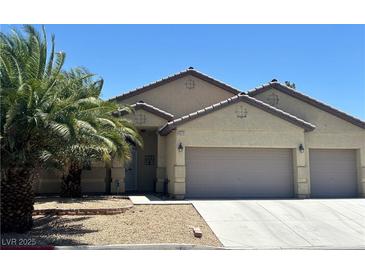 Charming single-story home with desert landscaping and a spacious three-car garage at 4620 Ventana Rey St, North Las Vegas, NV 89081
