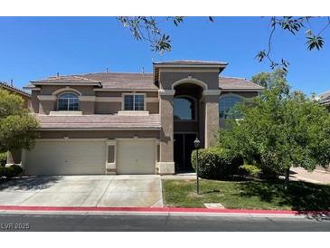 Charming two-story home featuring a three car garage, neutral paint scheme and well-maintained landscaping at 8812 Glenistar Gate Ave, Las Vegas, NV 89143
