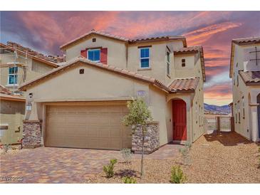 Inviting two-story home featuring a red door, neutral siding, and a well-manicured front yard at 2728 Tricase St, Henderson, NV 89044