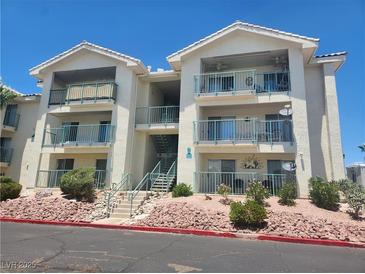 Inviting condo with desert landscaping, a balcony, and easy stair access at 3550 Bay Sands Dr # 2070, Laughlin, NV 89029