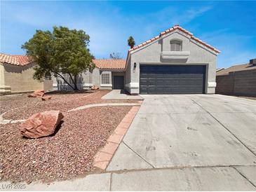Charming single-story home featuring a two-car garage and low-maintenance desert landscaping at 3804 Wren Ct, North Las Vegas, NV 89032