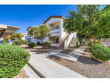 Inviting condo exterior with landscaped grounds and a private balcony at 5650 E Sahara Ave # 1001, Las Vegas, NV 89142