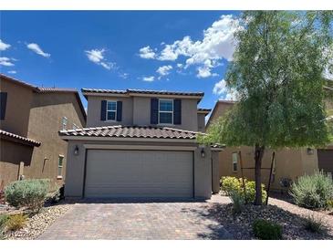 Charming two-story home with a well-maintained front yard, brick driveway, and a two-car garage at 9205 Valley Betica Ave, Las Vegas, NV 89148