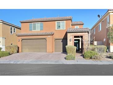 Charming two-story home featuring a three car garage and landscaped front yard at 2194 Trivero St, Henderson, NV 89044