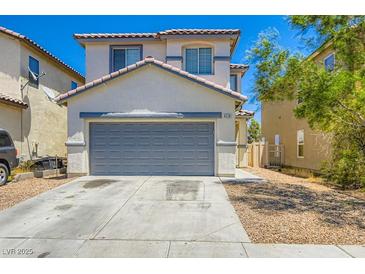 Charming two-story home with a neutral color palette, a gray garage door, and well-kept landscaping at 4118 Beech Family St, Las Vegas, NV 89115