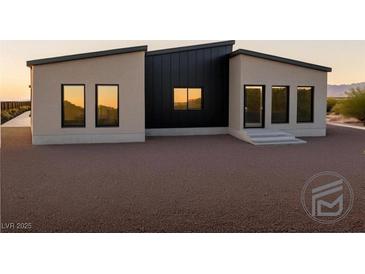 Modern home featuring minimalist landscaping and a unique contemporary design at 1321 Blagg, Pahrump, NV 89048