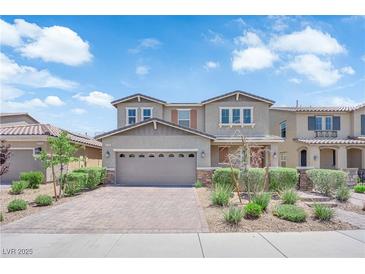 Charming two-story home with a two-car garage and beautifully landscaped front yard in a residential neighborhood at 2714 Frabiele St, Henderson, NV 89044