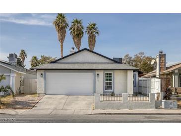 Charming single-story home with a two-car garage and low maintenance front yard at 59 N Christy Ln, Las Vegas, NV 89110