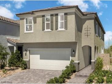Charming two-story home showcasing a two-car garage, and inviting entrance at 7394 Daly Grove St, Las Vegas, NV 89113
