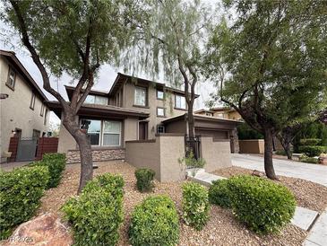 Charming two-story home with a well-maintained lawn and mature trees at 5466 Fawn Chase Way, Las Vegas, NV 89135