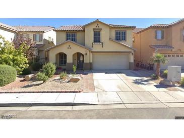 Charming two-story home with a well-manicured front yard and a two car garage, located in a tranquil suburban neighborhood at 5620 Siena Rose St, North Las Vegas, NV 89031