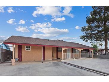 Charming single-story home featuring a welcoming covered porch and spacious front yard at 3715 Tabor Ave, North Las Vegas, NV 89030