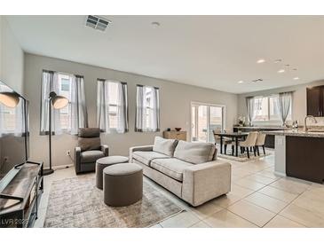 Bright and airy living room with neutral tones, plush seating, and abundant natural light at 113 Manzanita Falls Ave, North Las Vegas, NV 89031