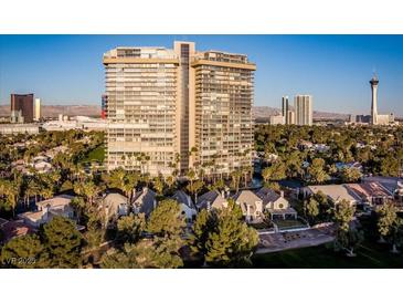 Stunning high-rise residential building with lush landscaping and panoramic city views at 3111 Bel Air Dr # 21A & 21C, Las Vegas, NV 89109