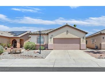 Charming single-story home with a neutral color scheme and a well-maintained front yard at 5918 Terra Grande Ave, Las Vegas, NV 89122